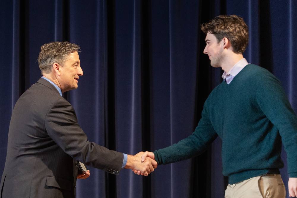 Thomas Finn shaking hands with Dr. Smart